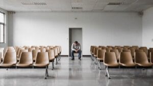 Young veteran in a waiting room — TBI and addiction in Veterans often goes undiagnosed for years after service
